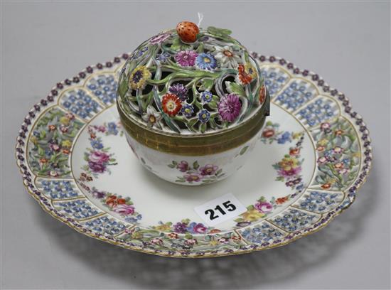 A Thuringian porcelain inkwell with pierced and flower-encrusted cover on conforming circular pierced stand